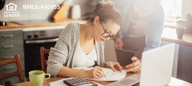 MAN AND WOMAN REVIEWING FINANCIAL INFORMATION 